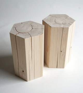 2 Hexagonal shaped solid hemlock stools with an oiled finish.